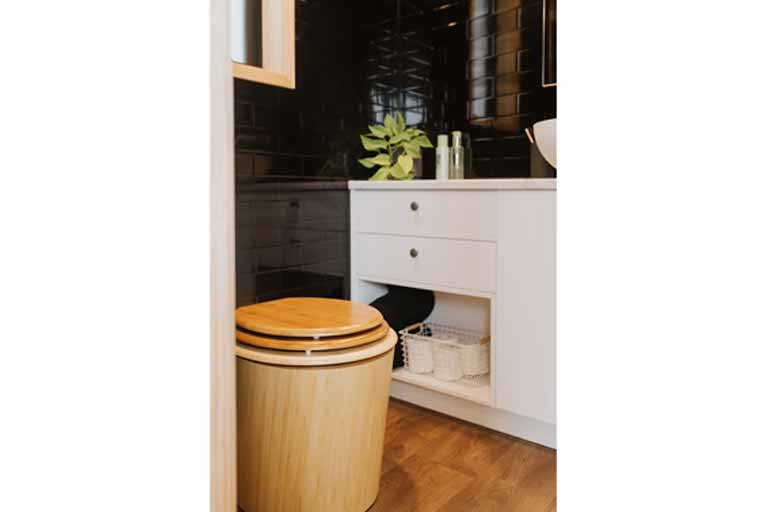 bathroom with a composting toilet