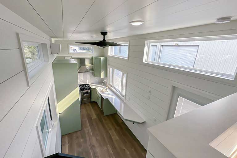 The Heese tiny house on wheels with clean interior color for functional living