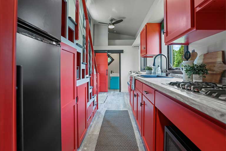 A funky tiny house with a unique color palette for a pizza lover