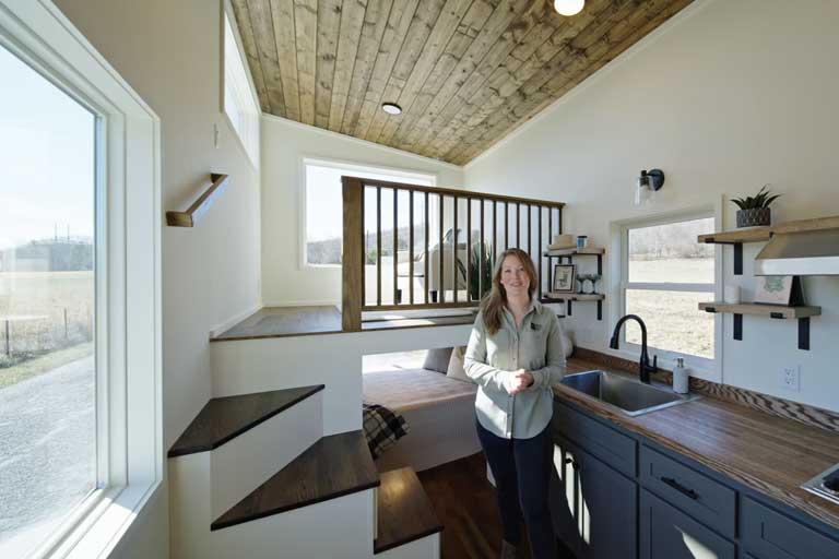 Unique reverse loft layout with main floor sleeping area and lofted living space.