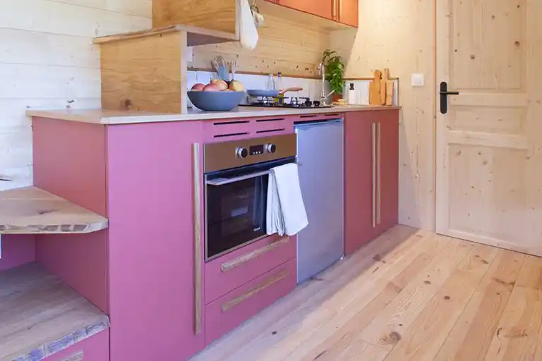 Kitchen with a gas hob, built-in oven, and stainless steel sink.