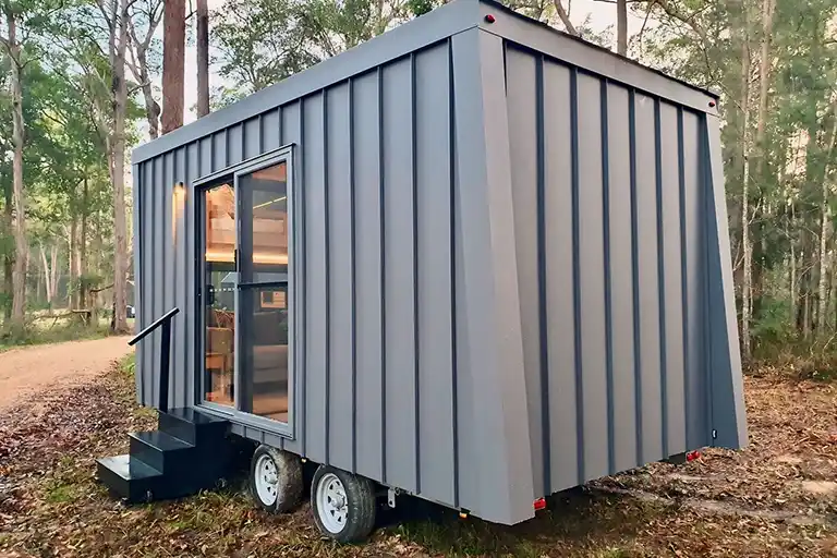 Efficient galley kitchen with high-quality fixtures in the Chipper Tiny House.