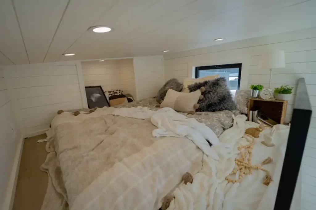 Sleeping loft sized for a queen bed with egress window.