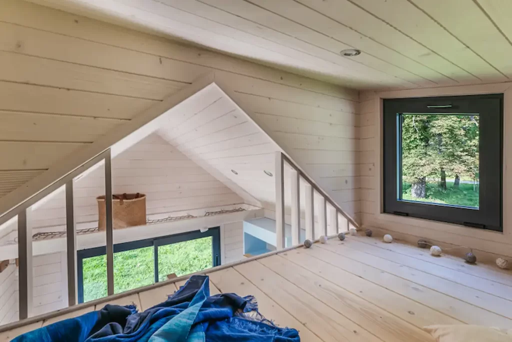 A compact 12.10m² home with an upstairs bedroom.